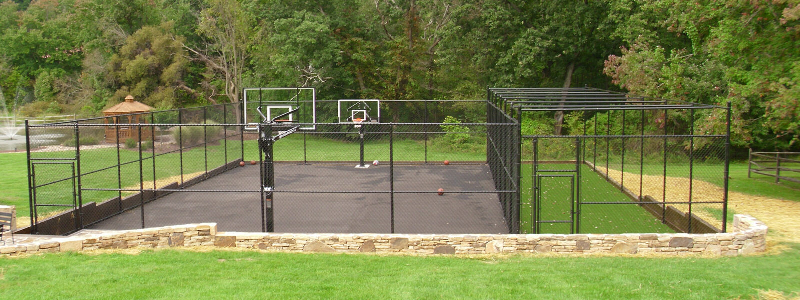 Why is plastic-coated chain link fence used for stadium fencing?